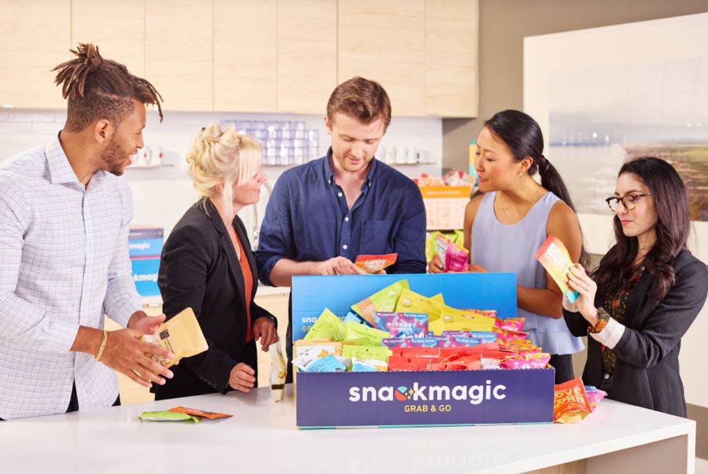 People holding snacks from SnackMagic 