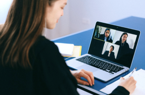 A young woman in a video meeting.
