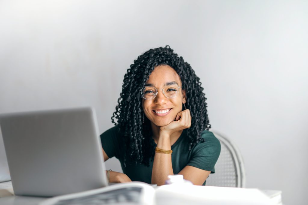 Woman smiling on her laptop