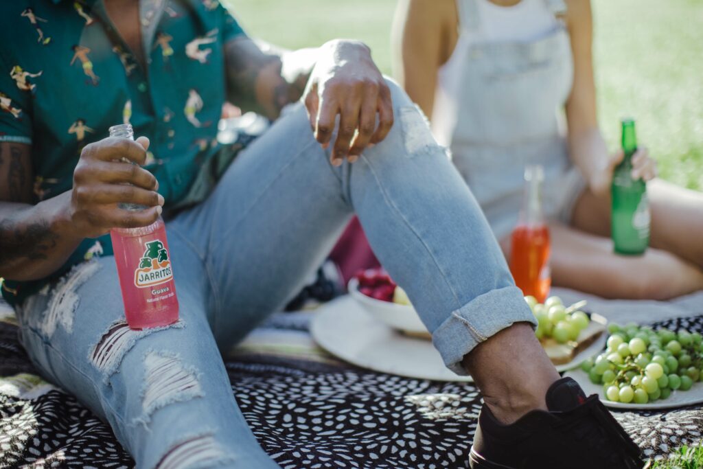 Two employees enjoying refreshments outside.